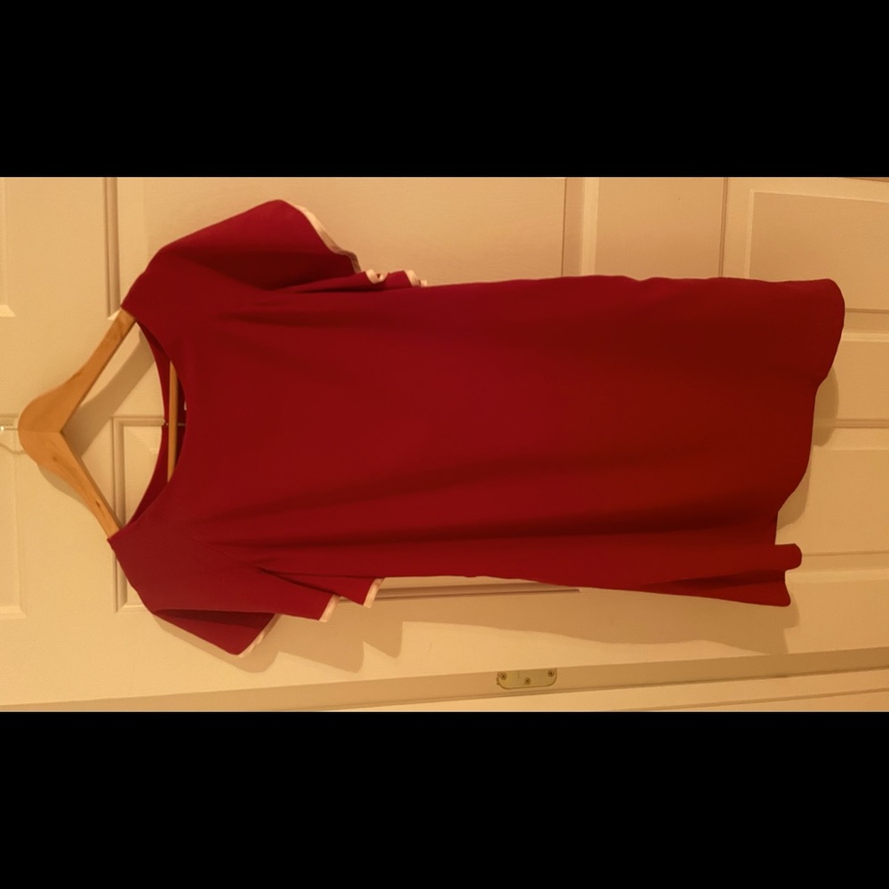 Airy burgundy dress with white trim.